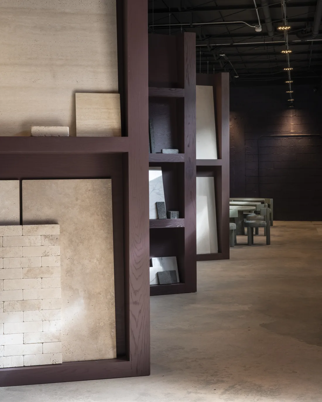 Interior designer selecting marble and travertine samples at ARCA Miami showroom